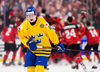 Sweden defenceman Jesper Sellgren skates away as Team Canada celebrates their gold medal victory at the World Junior Championships on Friday.
