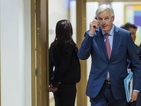 European Union chief Brexit negotiator Michel Barnier arrives for an EU general affairs meeting at the EU Council in Brussels on Monday, Jan. 29, 2018. European Union government ministers on Monday warned Britain that it cannot expect to have a say in EU decision-making once it leaves, including during a transition period.