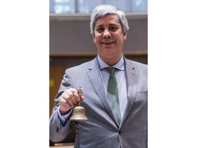 Eurogroup President and Portugal's Finance Minister Mario Centeno rings the bell as he opens an Eurogroup finance ministers meeting at the EU Council in Brussels on Monday, Jan. 22, 2018.