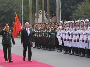 U.S. Defense Secretary Jim Mattis, right and his Vietnamese counterpart Ngo Xuan Lich, left, review an honor guard before heading for talks in Hanoi, Vietnam, Thursday, Jan. 25, 2018. Mattis is on a two-day visit to Vietnam to boost military ties between the two countries.