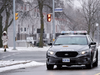A police car drives near Pauline Johnson Junior Public School in Toronto on Monday, Jan. 15, 2018.