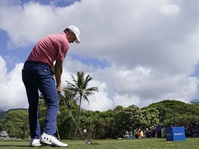 Jordan Spieth drives off the seventh tee during the first round of the Sony Open golf tournament, Thursday, Jan. 11, 2018, in Honolulu.