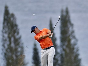 Jordan Spieth hits from the fourth fairway during the first round of the Tournament of Champions golf event, Thursday, Jan. 4, 2018, at Kapalua Plantation Course in Kapalua, Hawaii.