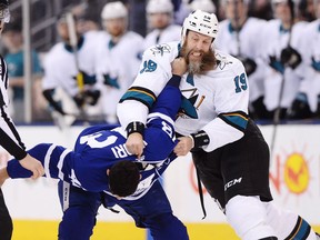 Toronto Maple Leafs forward Nazem Kadri (left) fights San Jose Sharks forward Joe Thornton on Jan. 4.