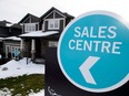 Beginning Jan. 1, families getting mortgages with down payments over 20 per cent must prove they could pay a theoretical interest rate that is two percentage points higher than what they actually negotiated with their lenders.