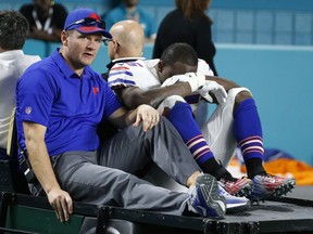 Buffalo Bills running back LeSean McCoy (25) is driven off the field after he was injured on a play, during the second half of an NFL football game against the Miami Dolphins, Sunday, Dec. 31, 2017, in Miami Gardens, Fla.