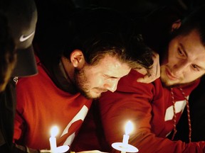 Washington State quarterback Luke Falk cries during a candlelight memorial service for fellow quarterback Tyler Hilinski, Friday, Jan. 19, 2018, in Pullman, Wash. Hilinski, a sophomore, committed suicide earlier in the week.