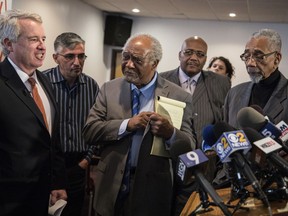 In this Jan. 3, 2018 photo, Democratic Illinois gubernatorial candidate Chris Kennedy, left,  gathers with community leaders to discuss gun violence in Chicago at a press conference accompanied by, from left, Chicago Alderman Rick Munoz, U.S. Rep. Danny Davis, Rev. Paul Jakes, and U.S. Rep. Bobby Rush in Chicago. Few people running for public office have been more personally affected by gun violence than Chris Kennedy. Now the 54-year-old Democrat has made the issue a centerpiece of his campaign for Illinois governor.