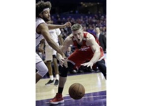 Ohio State center Micah Potter, right, battles for a loose ball against Northwestern center Barret Benson during the first half of an NCAA college basketball game Wednesday, Jan. 17, 2018, in Rosemont, Ill.