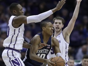 Northwestern guard Scottie Lindsey, left, and guard Bryant McIntosh guard Penn State guard Tony Carr during the second half of an NCAA college basketball game Saturday, Jan. 20, 2018, in Rosemont, Ill.