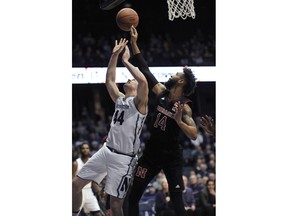 Northwestern's Gavin Skelly (44) and Nebraska's Isaac Copeland (14) vie a rebound during the first half of an NCAA college basketball game Tuesday, Jan. 2, 2018, in Rosemont, Ill.