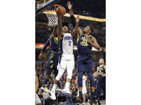 Orlando Magic guard Elfrid Payton (2) shoots in front of Indiana Pacers center Myles Turner (33) during the first half of an NBA basketball game in Indianapolis, Saturday, Jan. 27, 2018.