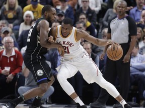Indiana Pacers' Thaddeus Young (21) is defended by Milwaukee Bucks' Khris Middleton during the first half of an NBA basketball game, Monday, Jan. 8, 2018, in Indianapolis.