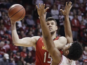 Maryland's Michal Cekovsky shoots over Indiana's Justin Smith during the first half of an NCAA college basketball game, Monday, Jan. 22, 2018, in Bloomington, Ind.