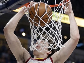 Cleveland Cavaliers' Cedi Osman dunks during the first half of an NBA basketball game against the Indiana Pacers, Friday, Jan. 12, 2018, in Indianapolis.