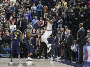 Cleveland Cavaliers' LeBron James misses a basket as time expires in an NBA basketball game against the Indiana Pacers, Friday, Jan. 12, 2018, in Indianapolis.