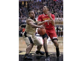 Purdue guard P.J. Thompson (11) steals the ball from Maryland guard Anthony Cowan (1) during the first half of an NCAA college basketball game in West Lafayette, Ind., Wednesday, Jan. 31, 2018.