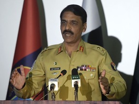 FILE - In this Monday, April 17, 2017, file photo, Pakistan's army spokesman Maj. Gen. Asif Ghafoor addresses a news conference in Rawalpindi, Pakistan. Ghafoor told that Pakistan wants to continue cooperation with the U.S. but will not "compromise on national interests and prestige."