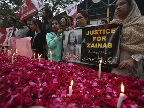 Supporters of the Christian People's Movement attend a memorial for Zainab Ansari, an 8-year-old girl who was kidnapped, raped and killed last week, in Karachi, Pakistan, Friday, Jan. 12, 2018.