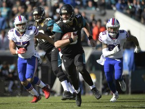 Quarterback Blake Bortles of the Jacksonville Jaguars scampers for big yardage against the Buffalo Bills during Sunday's AFC wild card action in Jacksonville. Bortles had a season-high 88 yards in leading the Jags to a 10-3 victory, earning a berth in next week's divisional game against Pittsburgh Steelers.