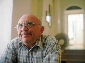 FILE - In this July 10, 1996 file photo, Israeli author Aharon Appelfeld sits in a Jerusalem cafe where he often worked on his novels in longhand. Appelfeld, esteemed Israeli novelist and Holocaust survivor who became among the country's leading voices in Holocaust literature, died Thursday, Jan. 4, 2018. He was 85.