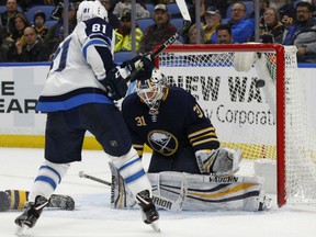 Winnipeg Jets forward Kyle Connor puts the puck past Buffalo Sabres goalie Chad Johnson during the second period Tuesday in Buffalo.