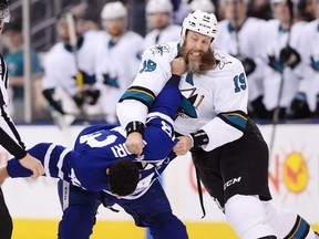 San Jose Sharks' Joe Thornton, right, fights with Toronto Maple Leafs' Nazem Kadri during first period NHL hockey action, in Toronto on Thursday, January 4, 2018. Kadri may have got off lightly for grabbing Thornton's beard in Thursday night's shootout win over the San Jose Sharks.
