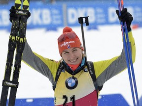 Anastasiya Kuzmina of Slovakia celebrates after winning the women's 7.5 kilometers sprint race at the Biathlon World Cup in Oberhof, Germany, Thursday, Jan. 4, 2018.