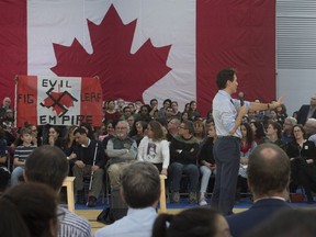 A heckler screams at Prime Minister Justin Trudeau during a town hall meeting Thursday, January 18, 2018 in Quebec City.