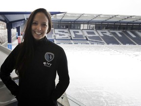 In this Thursday, Jan. 11, 2018 photo, Meghan Cameron, Sporting Kansas City's assistant director of player personnel, poses for a photograph at Children's Mercy Park in Kansas City, Kan. Cameron is settling into her job at Sporting, the first woman to manage player contracts, salary budget, and acquisitions for a Major League Soccer team.