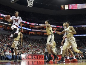 Louisville forward Dwayne Sutton (24) drives in for a layup past the Wake Forest defense during the second half of an NCAA college basketball game Saturday, Jan. 27, 2018, in Louisville, Ky. Louisville won 96-77.