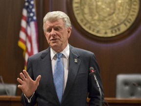 FILE - In this Jan. 5, 2018, file photo, Idaho Gov. C.L. "Butch" Otter speaks to reporters about the 2018 legislative session at the State Capitol in Boise, Idaho. Idaho officials are revealing details of a plan that will allow health insurance companies to ditch some federal coverage requirements of the Affordable Care Act, yet even the state's top insurance regulators aren't sure it's legal. Idaho's plan, announced by Otter earlier in January, would allow insurers to offer coverage plans on the individual market that don't meet some rules.