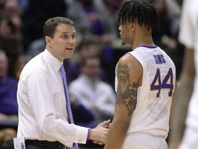 LSU coach Will Wade greets forward Wayde Sims (44) as he returns to the bench during the team's NCAA college basketball game against Texas A&M, Tuesday, Jan. 23, 2018, in Baton Rouge, La.
