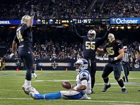 New Orleans Saints linebacker Jonathan Freeny (55) celebrates his sack of Carolina Panthers quarterback Cam Newton (1) on a third down, forcing the Panthers to kick a field goal, in the second half of an NFL football game in New Orleans, Sunday, Jan. 7, 2018.