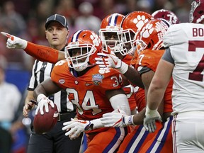 Clemson linebacker Kendall Joseph (34) celebrates a fuel recovery with teammates in the second half of the Sugar Bowl semi-final playoff game against Alabama for the NCAA college football national championship, in New Orleans, Monday, Jan. 1, 2018.