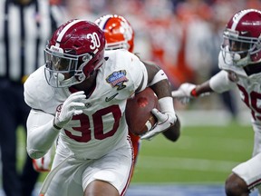 Alabama linebacker Mack Wilson (30) intercepts a pass and returns it for a touchdown in the second half of the Sugar Bowl semi-final playoff game against Clemson for the NCAA college football national championship, in New Orleans, Monday, Jan. 1, 2018.