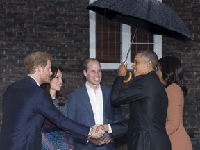 FILE - In this April 22, 2016 file photo, President Barack Obama and first lady Michelle Obama are greeted by the Duke and Duchess of Cambridge and His Royal Highness Prince Harry of Wales, shaking hands with the president, as they arrive at Kensington Palace in London. US President Donald Trump has wished Prince Harry and fiancee Meghan Markle well and says he is not aware of having received an invitation to their royal wedding in May.
