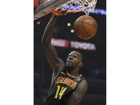 Atlanta Hawks center Dewayne Dedmon dunks during the first half of a basketball game against the Los Angeles Clippers, Monday, Jan. 8, 2018, in Los Angeles.