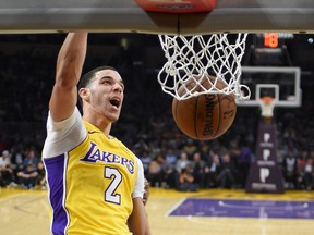 Los Angeles Lakers guard Lonzo Ball dunks during the first half of the team's NBA basketball game against the Charlotte Hornets, Friday, Jan. 5, 2018, in Los Angeles.