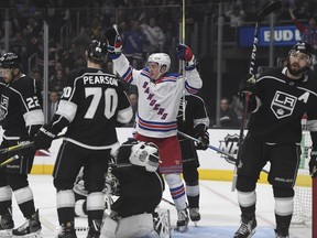 New York Rangers left wing Jimmy Vesey, center, reacts after scoring against the Los Angeles Kings during the first period of an NHL hockey game Sunday, Jan. 21, 2018, in Los Angeles.