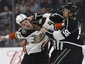 Los Angeles Kings defenseman Kurtis MacDermid, right, fights with Anaheim Ducks right wing Jared Boll during the first period of an NHL hockey game in Los Angeles, Saturday, Jan. 13, 2018.