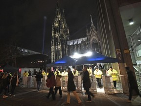 In this photo taken Dec. 31, 2017, security checkpoints surround the area next to the cathedral in Cologne, Germany. Police sought to prevent a repeat of New Year 2016 in Cologne, when hundreds of women were groped and robbed, mostly by groups of migrants.