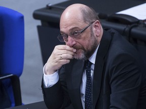 In this Jan. 18, 2018 file photo Martin Schulz, chairman of the Social Democratic Party, SPD, watches the plenary meeting of the German Bundestag in Berlin, Germany. Leaders of Germany's Social Democrats are making their final push to try and convince party members to approve opening talks with Chancellor Angela Merkel's conservatives on forming a new government.