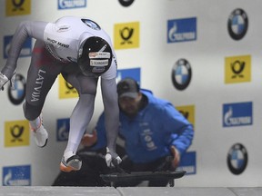 Latvia's Martins Dukurs starts his race at the skeleton World Cup in Koenigssee, Germany, Friday, Jan. 19, 2018.