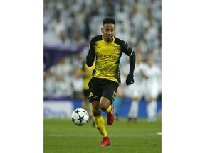 FILE - In this Dec. 6, 2017 file photo Dortmund's Pierre-Emerick Aubameyang runs with the ball during the Champions League Group H soccer match between Real Madrid and Borussia Dortmund at the Santiago Bernabeu stadium in Madrid, Spain.