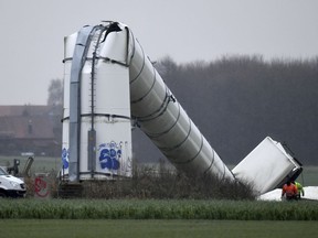 A wind power facility lies on a field after it collapsed during storm 'Burglind' in Volksdorf near Hannover, Germany, Wednesday, Jan. 3 2018. After parts of the rotor had broken, the tower of the roughly 70 meter tall wind wheel collapsed. Nobody was injured in the accident.