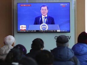 People watch a live broadcast of South Korean President Moon Jae-in's New Year's speech at the Seoul Railway Station in Seoul, South Korea, Wednesday, Jan. 10, 2018. Moon said he'll push for more talks and cooperation with North Korea to resolve the nuclear standoff, a day after the two Koreas held high-level talks for the first time in two years and agreed to cooperate in next month's Winter Olympics in South Korea.