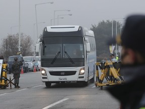 A bus carrying the South Korean delegations arrives at Unification Bridge, which leads to the Panmunjom in the Demilitarized Zone in Paju, South Korea, Monday, Jan. 15, 2018. The rival Koreas agreed to discuss a North Korean art troupe's visit to the Pyeongchang Winter Olympics in the South.