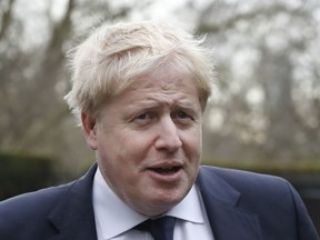 Britain's Foreign Secretary Boris Johnson arrives to hold a meeting with U.S. Secretary of State Rex Tillerson, in London, Monday, Jan. 22, 2018.