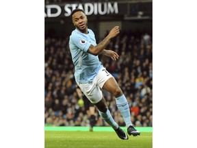 Manchester City's Raheem Sterling celebrates scoring his sides first goal during the English Premier League soccer match between Manchester City and Watford at Etihad stadium, in Manchester, England, Tuesday, Jan. 2, 2018.
